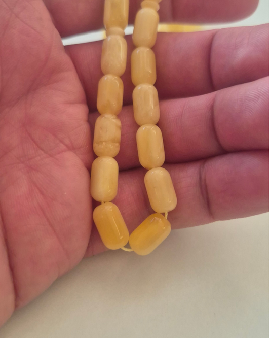 NaturAmber Baltık Sütlü Kehribar Tesbih — 12×7 mm Fıçı Kesim · 33 Tane