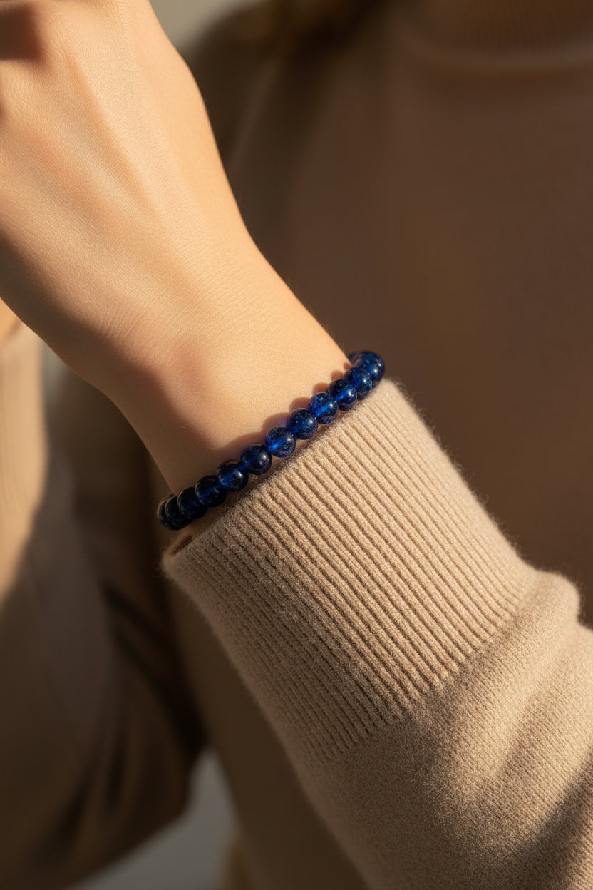 Blue beaded bracelet on a woman's wrist