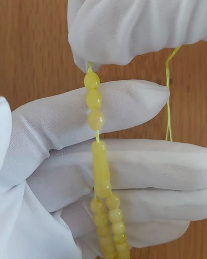 Beyaz Sütlü Kaya Damla Kehribar Tesbih — 7,5×6 mm Zeytin Kesim · 33 Tane - Baltık kehribarı